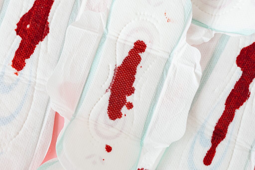 Close-up image of menstrual pads with visible blood stains, highlighting menstrual health.