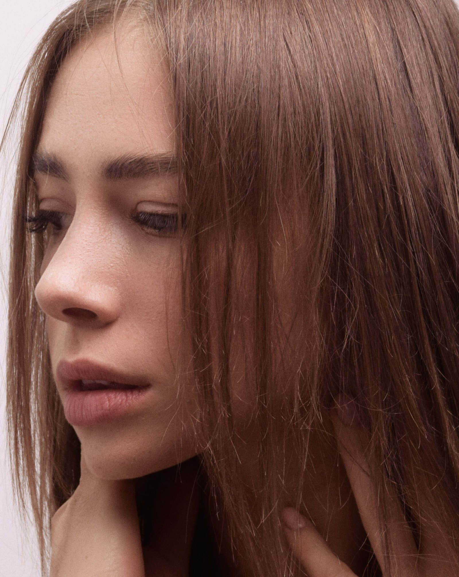 Beautiful close-up portrait of a woman with soft, natural lighting emphasizing her features.