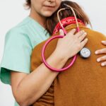 A healthcare professional offering comfort and support to a patient.