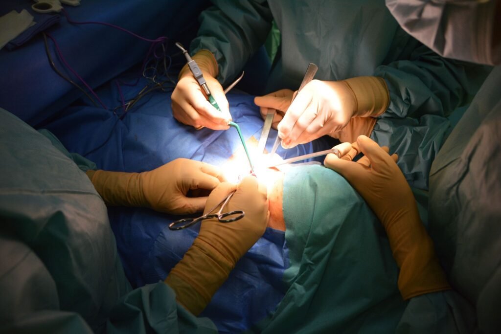 Close-up view of surgeons in an operating room performing a surgery with precision.